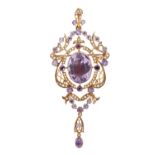 A gold, amethyst and seed pearl set pendant brooch, in an openwork pierced panel shaped design,