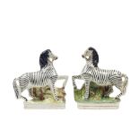 A pair of Staffordshire pottery flatback zebras, mid-19th century,