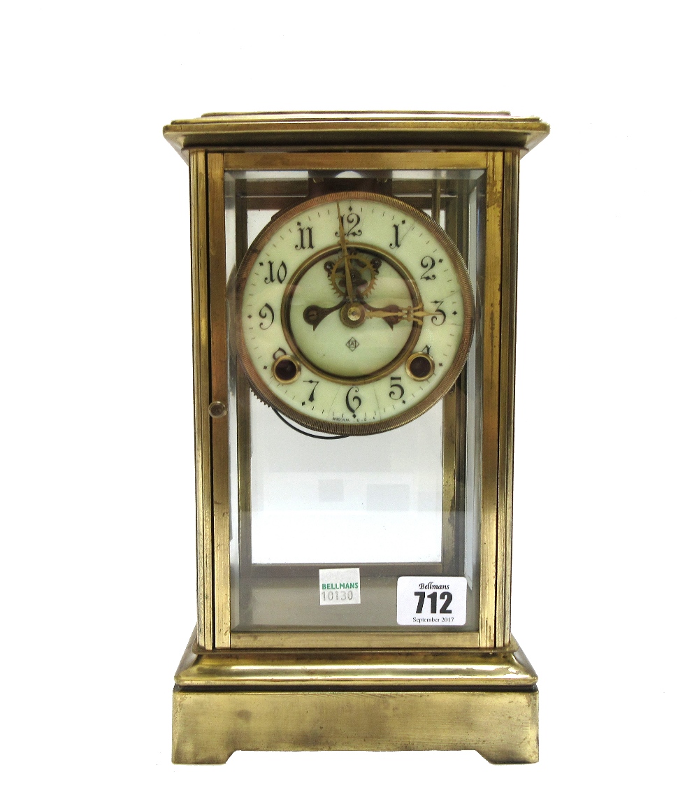 An Ansonia brass four glass mantel clock,