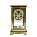 An Ansonia brass four glass mantel clock,