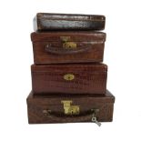 Four early 20th century crocodile skin jewellery cases,