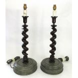 A pair of mahogany barleytwist table lamps, each on a painted 'marbled' wooden turned base,