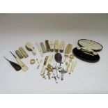 A quantity of Victorian ivory mounted part dressing table sets, ivory carved prayer beads,