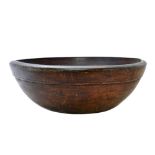 A massive George III sycamore turned bowl with ribbed decoration, 61cm diameter x 21cm high.