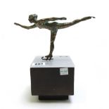 A Curtis Jere bronze skater, circa 1970, mounted on a perspex and wooden block, signed, 21cm high.