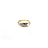 A gold and diamond three stone ring,