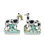 A pair of Staffordshire pottery models of `Disraeli' greyhounds, 19th century,
