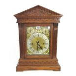 A German oak cased mantel clock, late 19th century, of architectural form,
