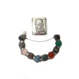 A silver, carnelian, rose quartz, moss agate and gem set bracelet, decorated with floral divisions,