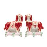A pair of Staffordshire pottery spaniels, circa 1850, each dog modelled standing,