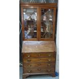 A George III and later mahogany bureau bookcase,