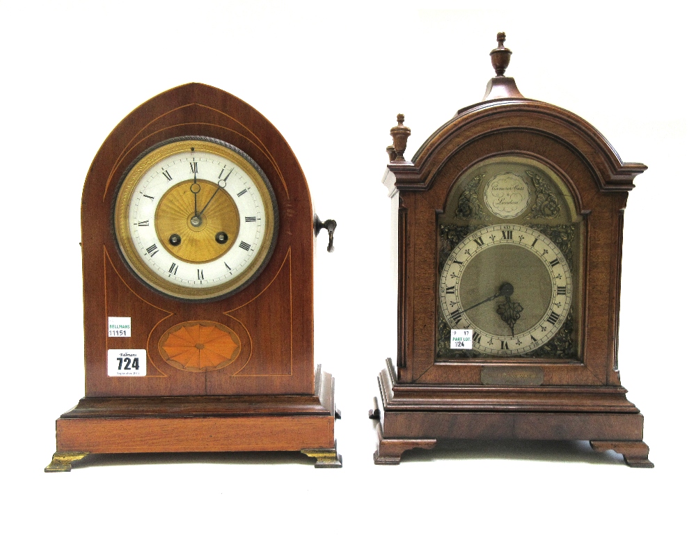 An Edwardian mahogany and inlaid mantel clock of navette shape,