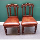A set of four 19th century Gothic Revival oak dining chairs,
