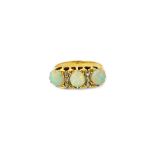 A gold, opal and diamond ring,