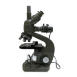 A Japanese "Olympus" binocular microscope, late 20th century, with accessories, cased.