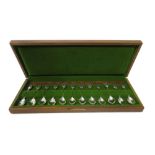 A set of twelve silver teaspoons, with the original fitted wooden case and paperwork,