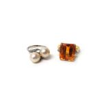 A gold ring, claw set with a cut cornered rectangular step cut citrine at the centre,