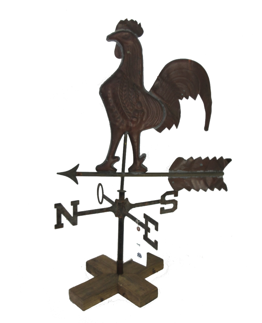 A copper coloured cockerel weather vane, 20th century, mounted on a wooden base, 86cm high.