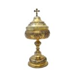 A Continental silver gilt ciborium, with embossed decoration, on a circular foot,