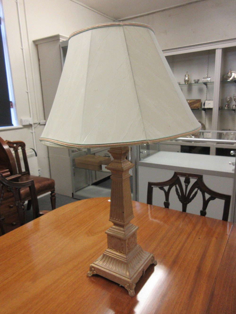 A pair of modern gilt and patinated metal table lamps, each of square tapering fluted column form,