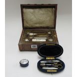 A mid-19th century French sewing box with part silver and steel fitted tools,