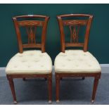 A pair of early 19th century Biedermeier brass inlaid walnut side chairs,