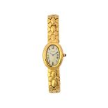 A lady's Cartier Baignoire quartz 18ct gold bracelet wristwatch,