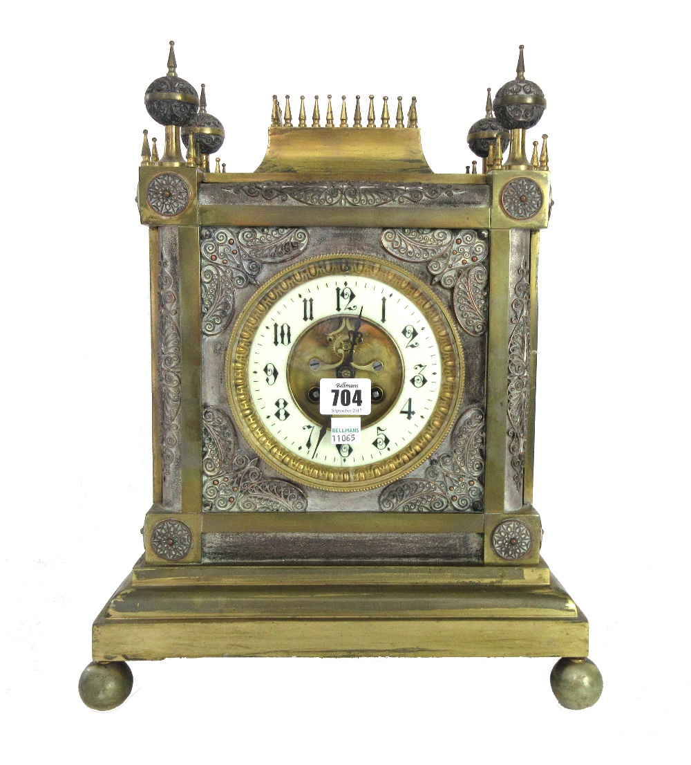 A French gilt brass cased mantel clock of Gothic cathedral form,