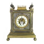 A French gilt brass cased mantel clock of Gothic cathedral form,