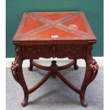 A late 19th century Art Nouveau red lacquered envelope card table,