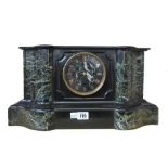 A late 19th century black slate and green marble mantel clock, of breakfront serpentine form,