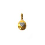 An 18ct gold and diamond set oval pendant locket by Annouska, the front with a heart shaped motif,