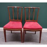 A pair of early 19th century Continental elm dining chairs,