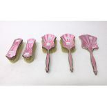 A lady's five piece silver and pink enamelled dressing set,