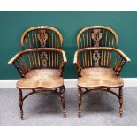 A pair of George III style elm and ash Windsor chairs, each with pierced splat and solid seat,