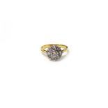 A gold and platinum, diamond set nine stone cluster ring,