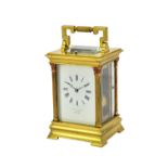 A French hour repeating gilt brass cased carriage clock by E.