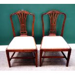 A set of six 19th century mahogany dining chairs, with arched crest rail and pierced splat,