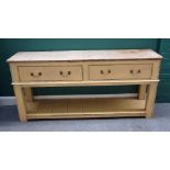 An early 19th century and later pine two drawer dresser base,