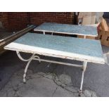 A pair of rectangular tables, each with inset stone top on a white painted metal base,