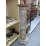 A Victorian variegated grey marble pedestal stand of circular ribbed form, on an octagonal base,