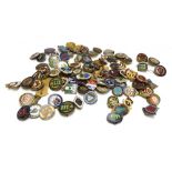 A quantity of brass and enamel badges, mid-20th century, all associated with lawn bowls,
