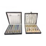 A set of six Danish silver gilt and vary coloured enamelled trident shaped forks by Egon Laurisden,