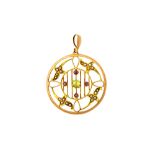 A gold, peridot, seed pearl and red gem set pendant, in a pierced openwork design,