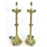 Three pairs of English metal table lamps, 20th century, adapted from altar candlesticks,