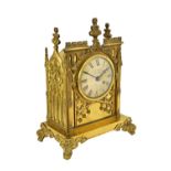 A gilt brass cased mantel clock, 19th century, of Gothic cathedral form,