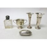 Silver and silver mounted wares, comprising; a twin handled trophy cup, two vases,