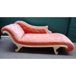 A Regency style cream painted chaise longue, with roll over ends and scroll supports,