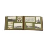 A Vintage photograph album containing in