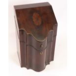 A George III mahogany chevron banded knife box, of serpentine outline,